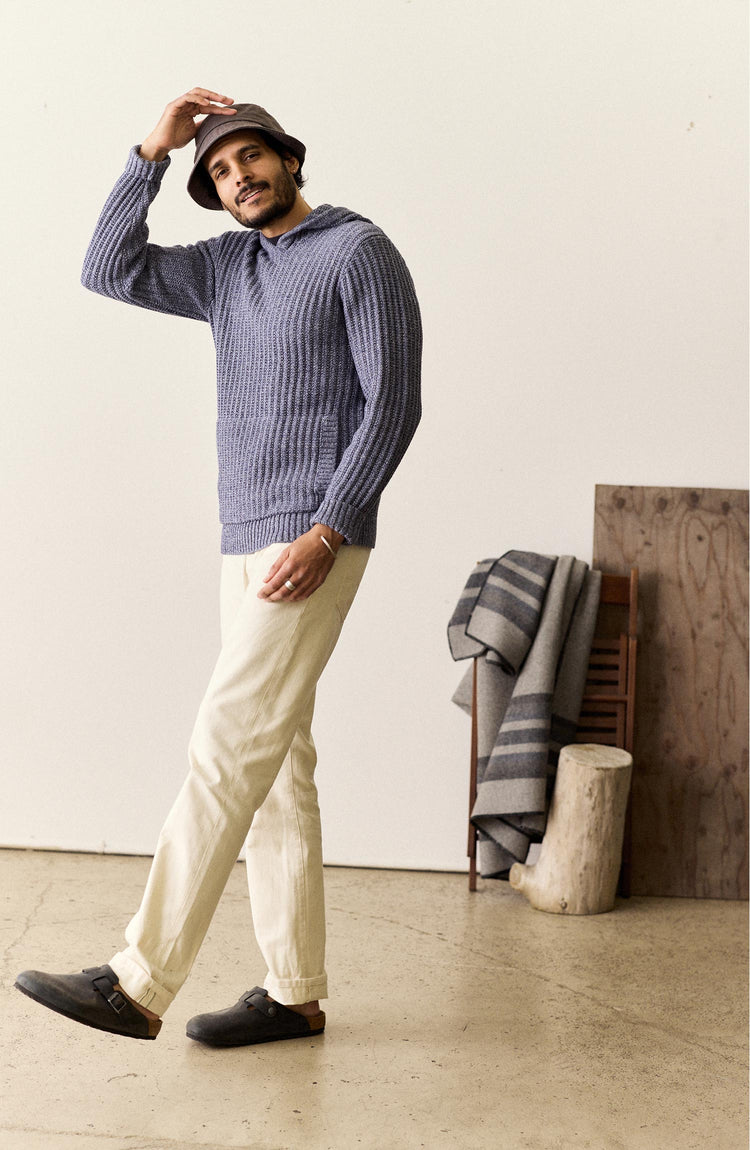 fit model posing in The Bryan Pullover Sweater in Blue Melange