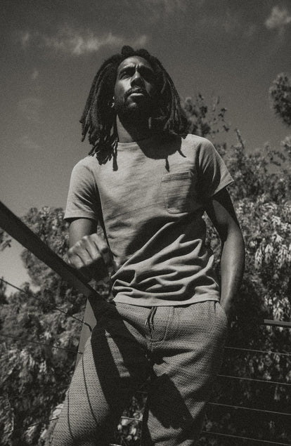 fit model posing in The Heavy Bag Tee In Smoked Olive