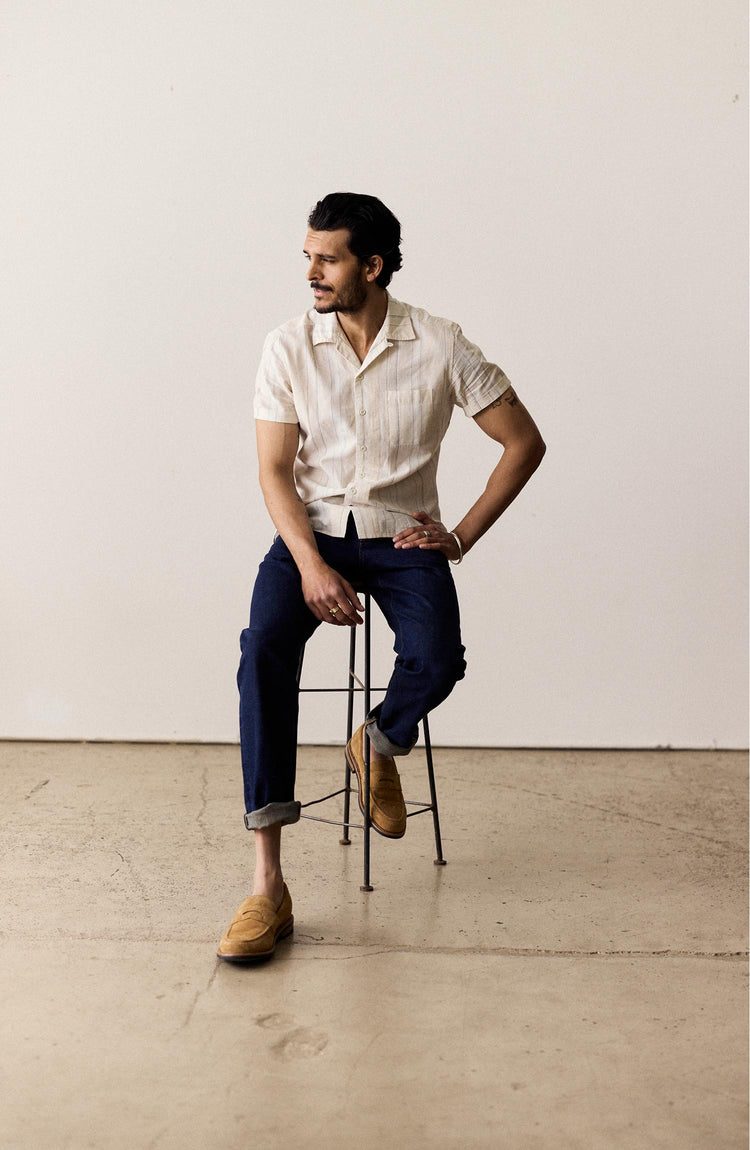 fit model sitting in The Short Sleeve Hawthorne in Fog Stripe
