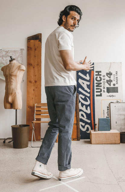 Our model standing in The Morse Pant in Washed Indigo Stripe
