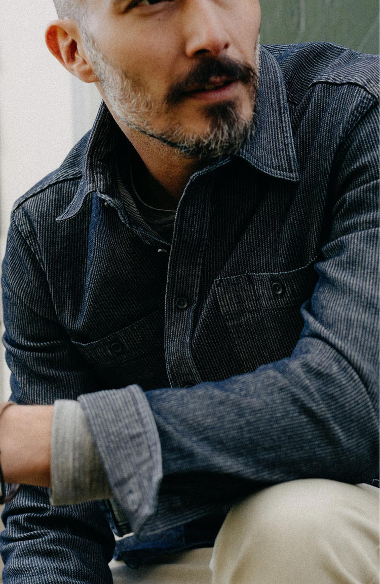 Our model wearing The Utility Shirt in Rinsed Indigo Stripe