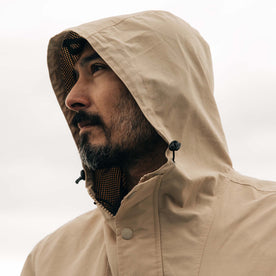 fit model showing off the hood on The Chapman Anorak in Light Khaki