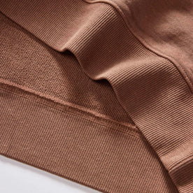 material shot of the ribbed hem on The Cotton Hemp Crew in Faded Brick