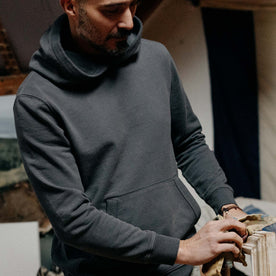 fit model showing the front of The Cotton Hemp Hoodie in Asphalt