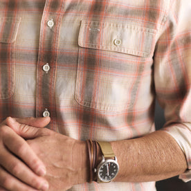 fit model showing off the pockets on The Craftsman Shirt in Brick Shadow Plaid