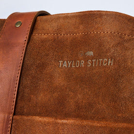 material shot of the branding on The Roughout Tote in Chocolate Suede