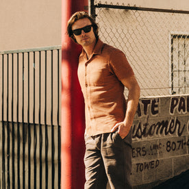 fit model standing in The Short Sleeve Hawthorne in Rust Pickstitch Waffle