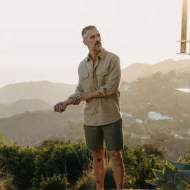 fit model adjusting the cuffs on The Point Shirt in Heather Oat Linen Tweed