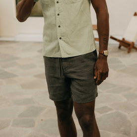 fit model posing in The Apres Short in Faded Black Hemp