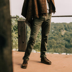 fit model wearing the foundation pant, standing on deck