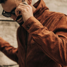 fit model adjusting glasses wearing The Wyatt Jacket in Chocolate Suede